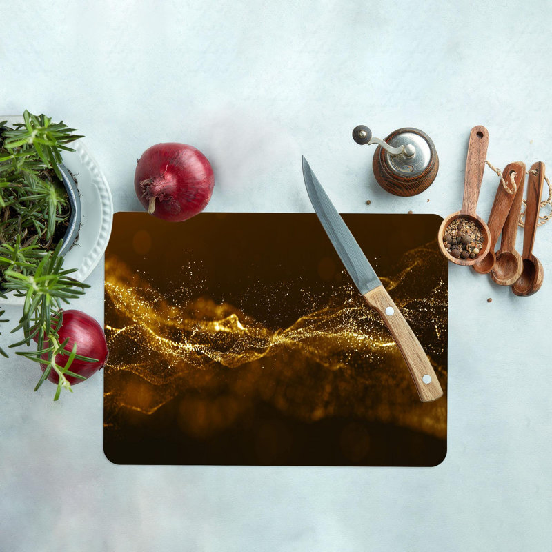Planche à découper moderne en verre chatoyant doré idéale pour la préparation de la viande dans la cuisine à domicile