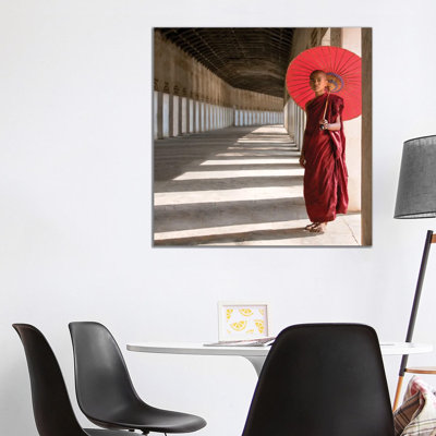 Buddhist Monk With Red Umbrella, Bagan, Myanmar by Jan Becke - Wrapped Canvas Print