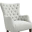 Fauteuil à oreilles capitonné
