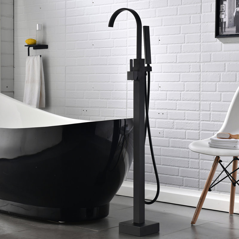 Robinet de baignoire à fixation au sol en laiton avec douche à main et design attrayant - baignoire noire matte