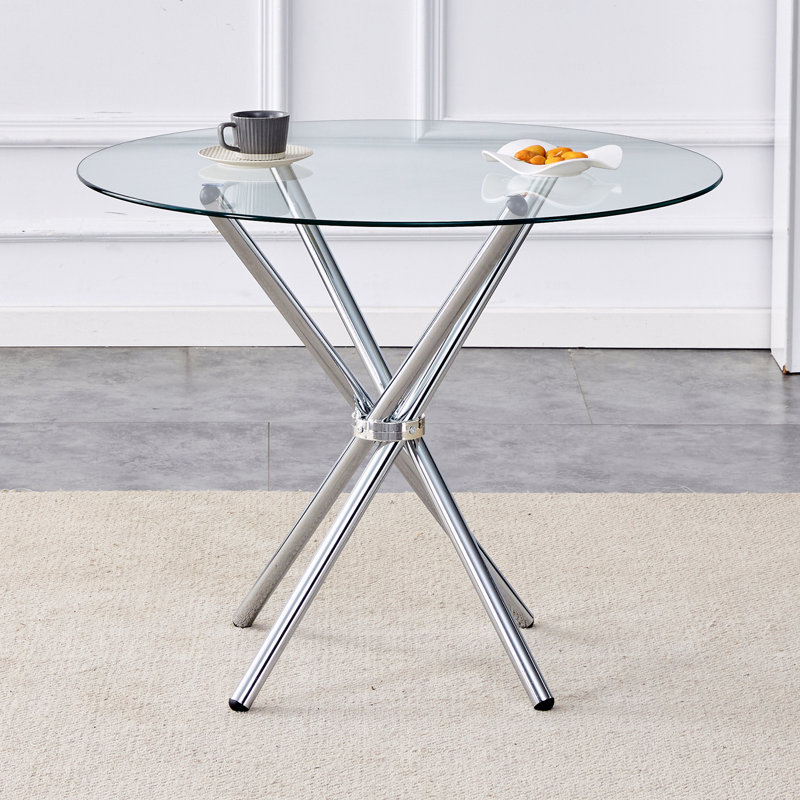 Table de salle à manger ronde en verre transparent avec une forme unique pour 4-6 personnes, avec des pieds en métal argentés en forme d'anneau