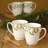 Noritake Holly and Berry Gold Coffee Mugs, 12 oz.