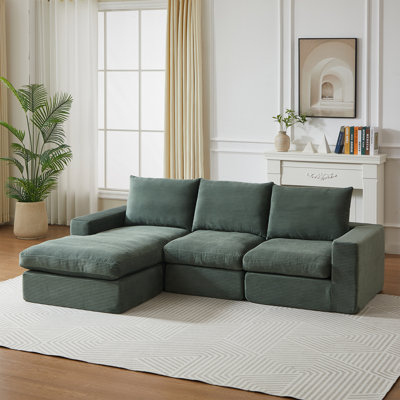 Modulaire spacieux en velours côtelé vert avec coussins confortables, style moderne pour la maison