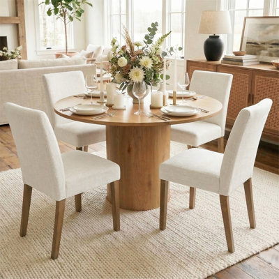 Danayla 4 - Person Dining Table Sets With 41.5'' Round Table & 4 Upholstered Linen Chairs