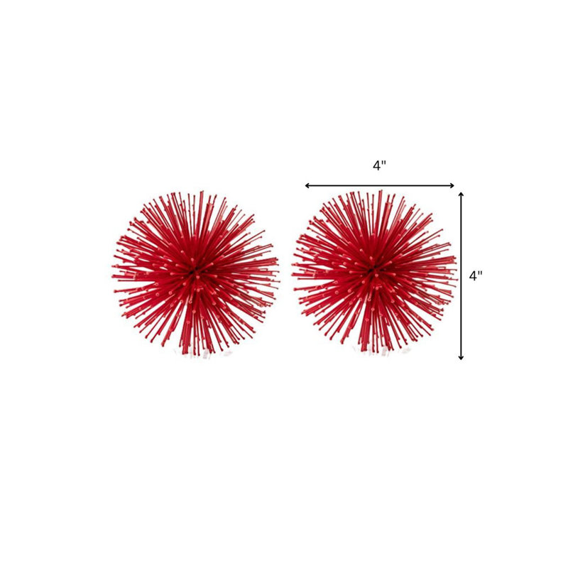 Ensemble de deux sculptures de table sphériques en fer, Rouge