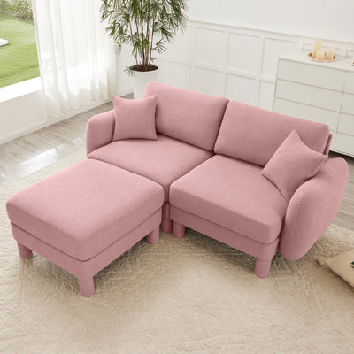 Canapé modulaire 2 de conception moderne avec des pieds cylindriques, des coussins de dossier et de siège moelleux et rembourrés en mousse dense et élégante.