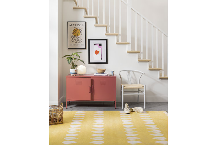 entryway with a large yellow floor rug