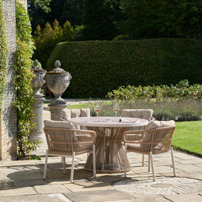 Aris 4 - Person Round Patio Dining Set with Cushions included