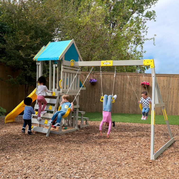 https://assets.wfcdn.com/im/95077464/resize-h755-w755%5Ecompr-r85/1810/181037328/Seacove+Wooden+Playset%2FSwing+Set+With+Table+%26+Bench%2C+Slide+And+Rock+Wall%2C+Blue+And+Yellow.jpg