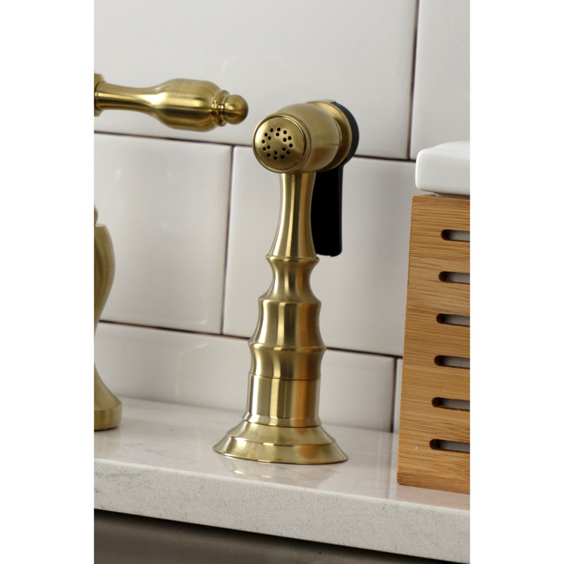 Kingston Brass Tudor Two-Handle 3-Hole Deck Mount Bridge Kitchen Faucet with Brass Side Sprayer, Brushed Brass