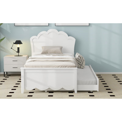 Lit simple en bois blanc avec tête de lit et lit gigogne confortable