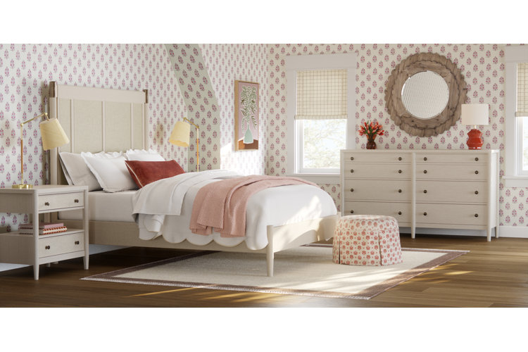 full size bed in a bedroom with a medium sized area rug placed under the bed