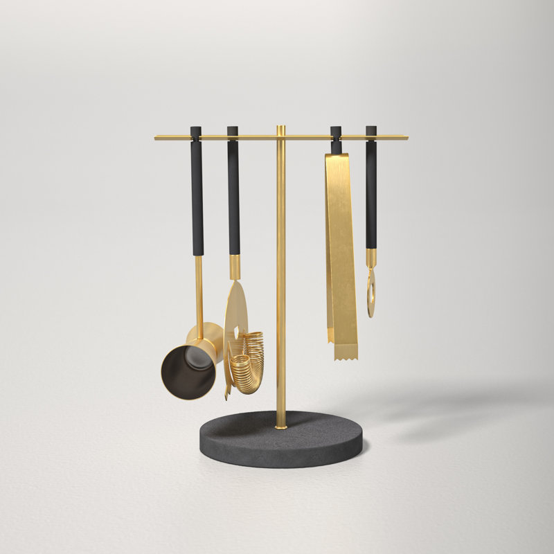 A black and gold stand with four cocktail accessories hanging on it