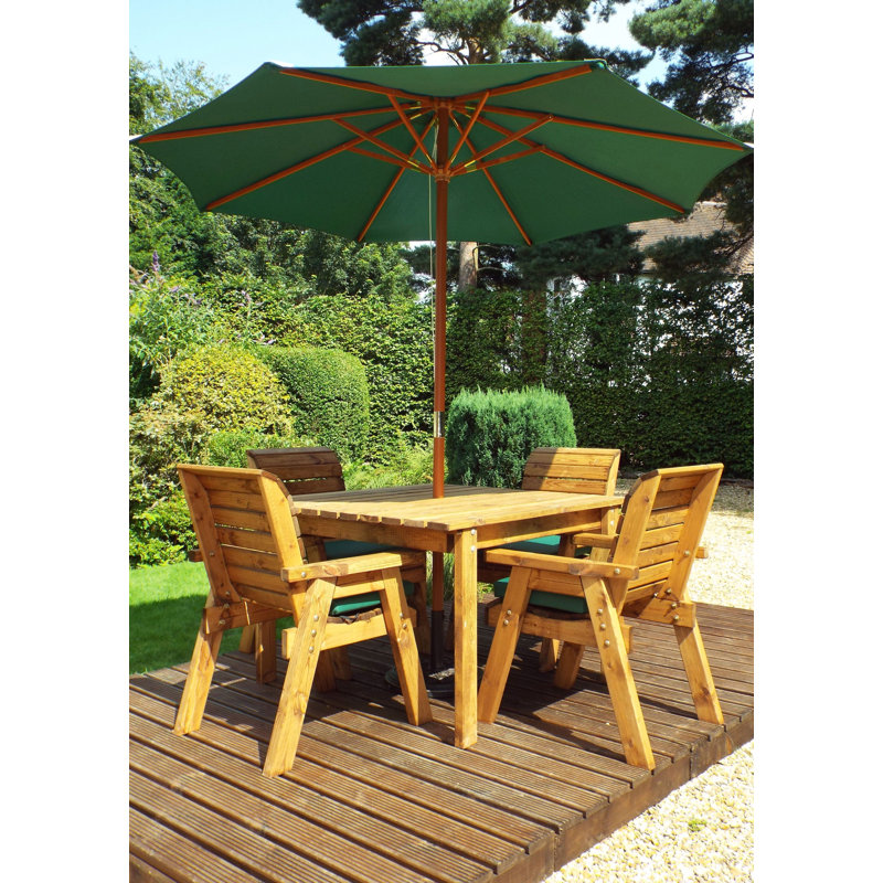 Felder 4 - Person Wood Patio Dining Set with Square Table , Cushions Included, Green