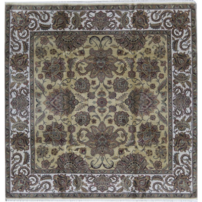 Tapis rond doré et ivoire de haute qualité noué à la main