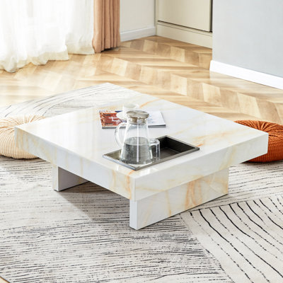 Une table basse moderne et pratique avec des motifs en imitation marbre, fabriquée en panneau de fibres à densité moyenne. La fusion de l'élégance et de la mode naturelle 31,4 po x 31,4 po x 12 po