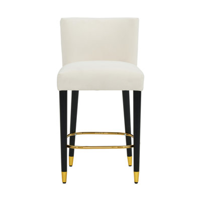 Le tabouret de 27 pouces au design moderne avec un tissu lisse de couleur claire et un repose-pieds circulaire avec une finition dorée crée un look sophistiqué et luxueux