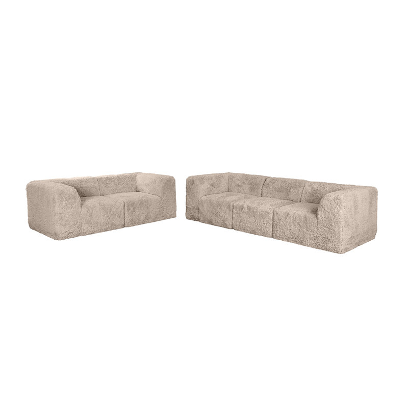 Canapé modulaire deux places couleur taupe, garni de fausse fourrure et de mousse haute densité compressée, avec accoudoirs et coin d'angle.