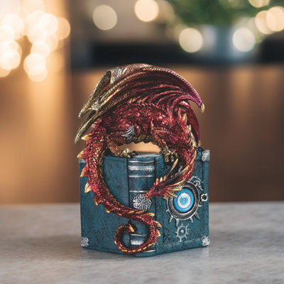 Figurine dragon rouge 7,5 "sur un livre