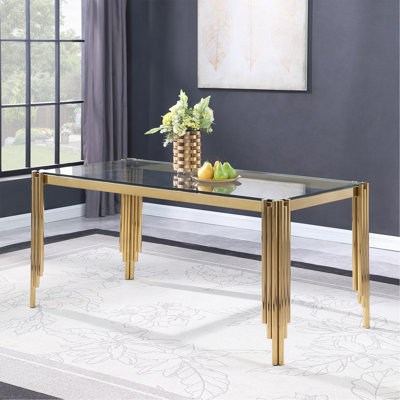 Table de salle à manger avec plateau en verre et cadre en métal