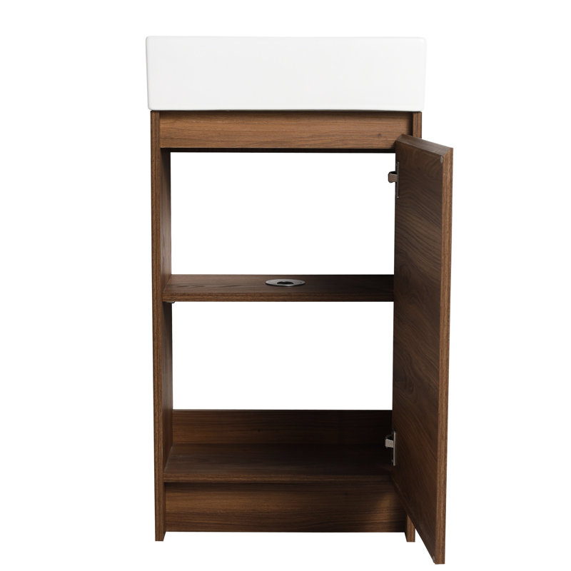 Meuble-lavabo autoportant de 18 po avec lavabo simple. Assemblage sans couture de l'armoire. Bassin en céramique solide. Ébène brun pour les salles de bain compactes. Portes à fermeture en douceur.