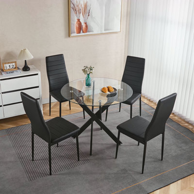 Table de salle à manger noire avec pieds croisés en métal et verre trempé