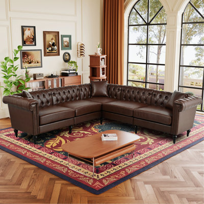 Canapé Chesterfield en forme de L avec garniture cloutée et conception capitonnée
