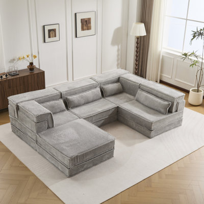 Canapé d'angle convertible Mahjong gris, 4 places, en polaire circulaire, sans montage, idéal pour lire et dormir. Mousse à mémoire de forme haute densité, idéale pour les petits espaces et les pièces multiples.