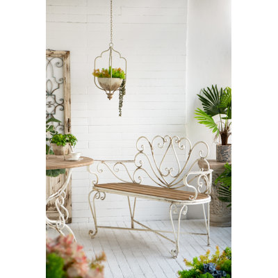 49x19x36" Distressed White Iron Bench With Brown Wooden Seat And Scrollwork Heart Design by One Allium Way