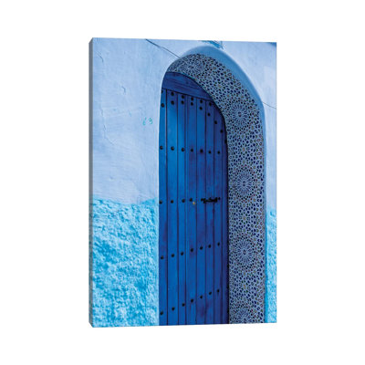 Africa, Morocco, Chefchaouen. Arch Over Wooden Door. by Jaynes Gallery - Wrapped Canvas Print
