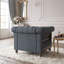 Fauteuil club capitonné d'inspiration Chesterfield avec accoudoirs