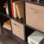 Bibliothèque modulaire à 9 cubes avec compartiments de rangement spacieux pour les livres et la décoration, finition noire élégante.