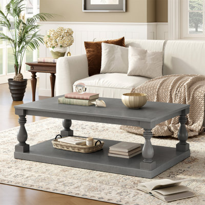 Table basse avec pieds de colonne en forme de vase artistique et placage de pin luxueux pour un charme intemporel, convient au salon, à la salle d'étude