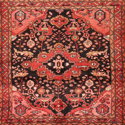 Tapis oriental en laine et polyester rouge et noir tissé au métier mécanique