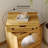 Robot-Shaped Wood End Table - 360° Rotating Storage Chest, 3-Color LED Lights & Lockable Rolling Wheels