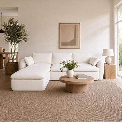Canapé d'angle à compression, en mousse chenille blanc laiteux, style moderne et confortable.