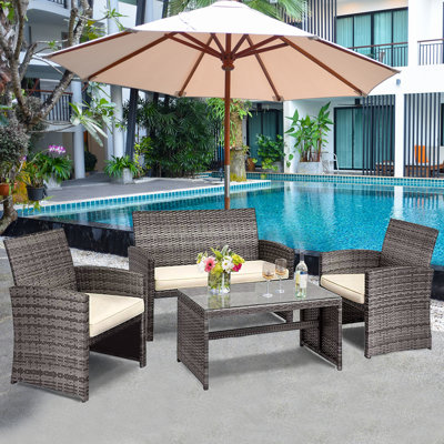 Akshath 4pcs Patio Rattan Furniture Conversation Set With Glass Table Top And Cushions