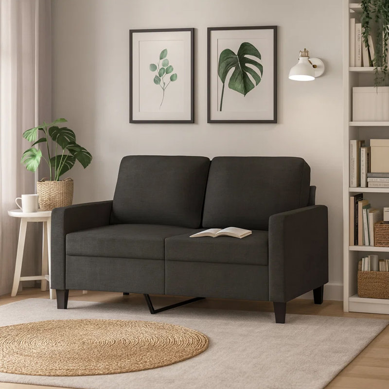 Causeuse moderne en polyester noir avec une silhouette minimaliste simple