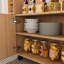 Îlot de cuisine multifonctionnel avec tablettes de rangement, roulettes et abattant double-640868902