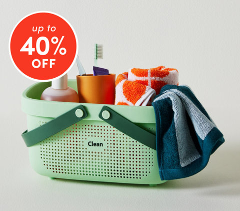 Bathroom storage up to 40% off featuring mint green shower caddy with toiletries and towels