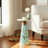 Glass and Wood Accent Table with Tapered Base and Modern Design.