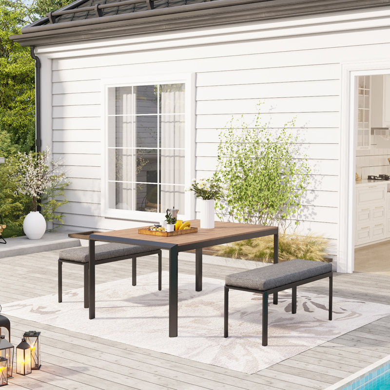Craver 4 - Person Patio Dining Set Rectangular Table with Cushions Included