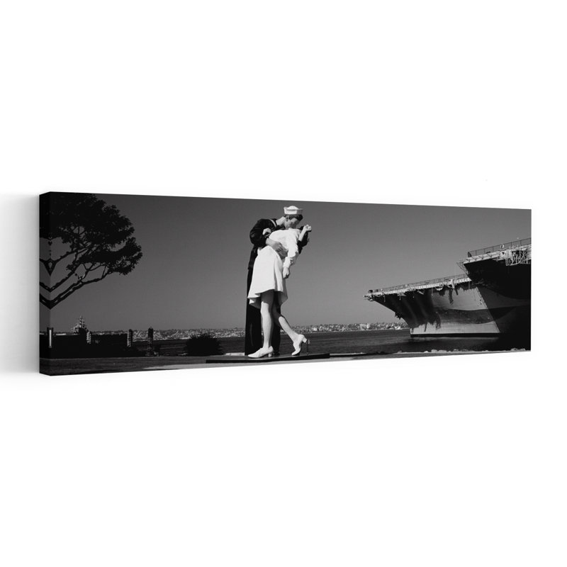 The Kiss Between A Sailor And A Nurse Sculpture Unconditional Surrender San Diego Aircraft Carrier Museum San Diego California USA by Dan Merkel - Wrapped Canvas Panoramic Print
