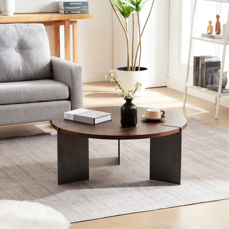 Table basse au design rond en noyer - pieds en métal noir, surface et pieds décoratifs brun foncé moderne