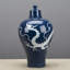 Pot en porcelaine bleu foncé avec motif de dragon blanc