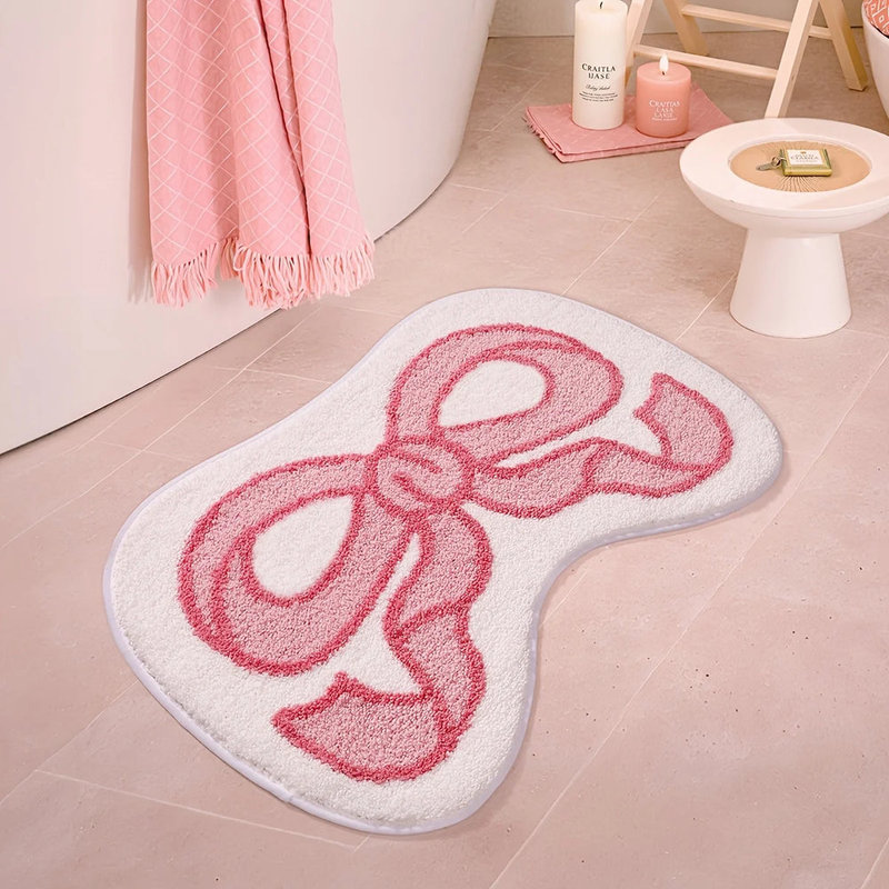 Tapis de bain pelucheux rose