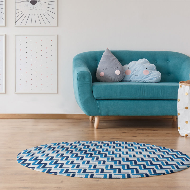Tapis rond bleu à motif géométrique