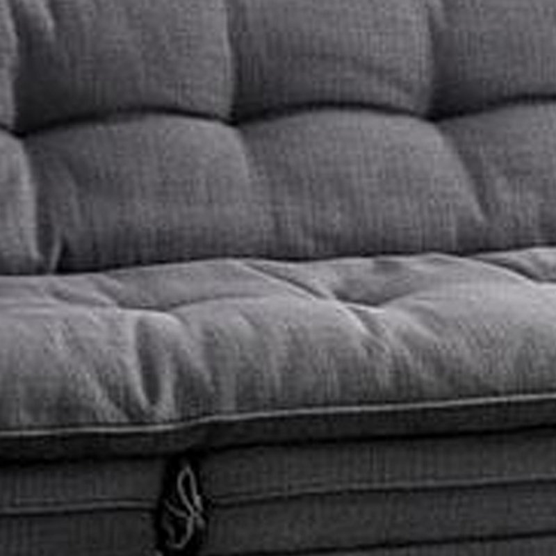 Canapé futon, revêtement en tissu gris, capitonnage à boutons, structure en bois massif