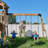Backyard Discovery Dover Bay Spruce Wood Swing Set with Wave Slide, Tube Slide, Clubhouse, and Rock Wall