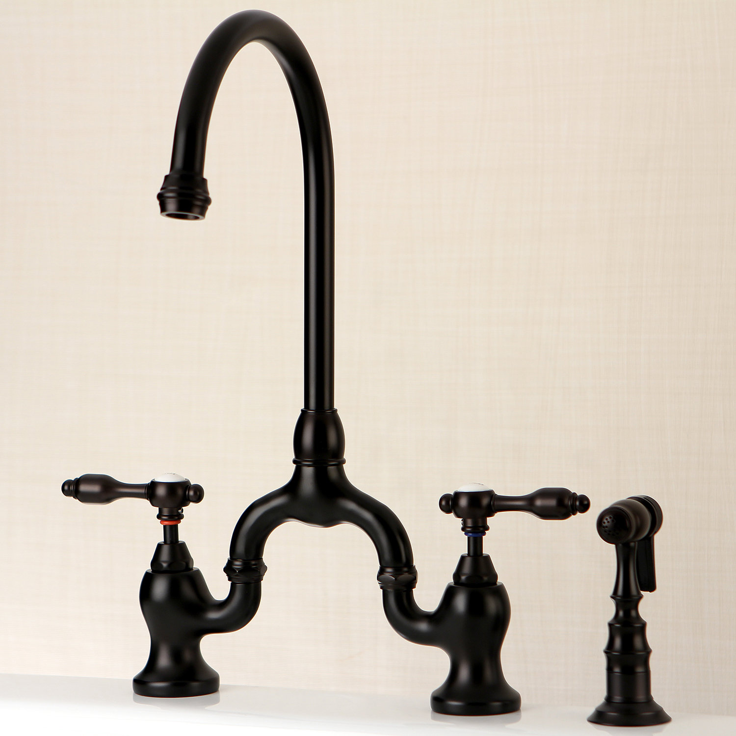 Kingston Brass Tudor Two-Handle 3-Hole Deck Mount Bridge Kitchen Faucet with Brass Side Sprayer, Oil Rubbed Bronze